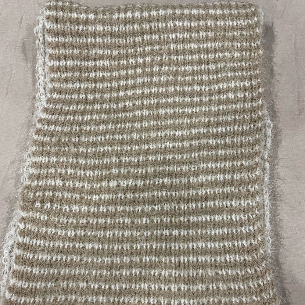 Simply Noelle infinity knit scarf. Acrylic and nylon based. Tan and white